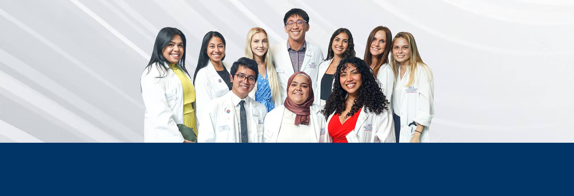 Medical students wearing their white coats